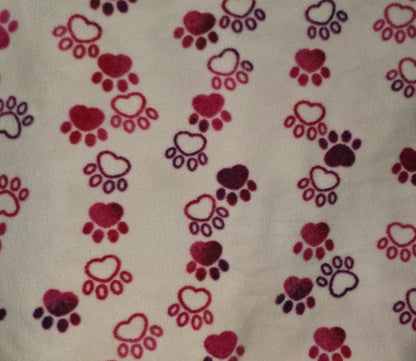 Pink and purple paw printed fleece dog blanket.
